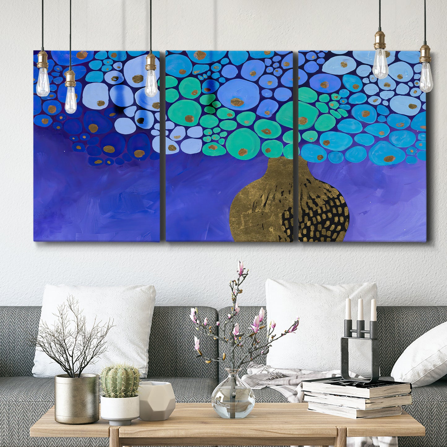 Three-panel canvas wall art featuring blue poppy floral abstraction, displayed in a modern living room above seating.
