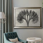 Vintage botanical plant study photograph by Karl Blossfeldt in an ornate mottled silver frame displayed in a neutral interior setting.