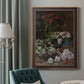 Early impressionist floral painting by Claude Monet in an ornate bronzed mahogany wood frame displayed in a dark-toned interior setting.