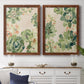 Set of two maple barnwood framed canvas prints depicting a coordinated art pair of dense repeating succulents and small flowers rendered as decorative botanical pattern prints above a dining room sideboard.