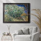 Impressionist lilac flower painting by Vincent van Gogh in an ornate black frame with gilded inner detail displayed in a bright interior setting.