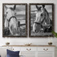 Set of two black barnwood framed canvas prints depicting a coordinated art pair of black-and-white close-up portraits of horses at fences rendered as modern equestrian photography above a dining room sideboard.