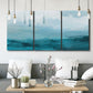 Three-panel canvas wall art featuring vertical coastal elements with rising light, displayed in a modern living room above seating.