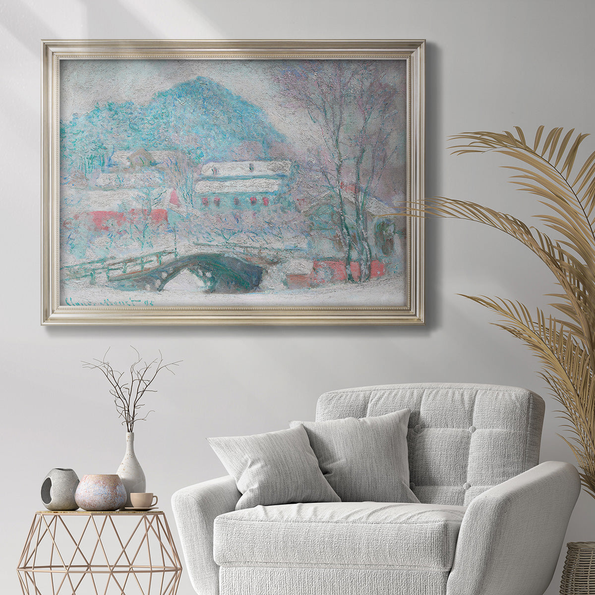 Impressionist coastal village landscape in Norway by Claude Monet in an ornate champagne frame displayed in a bright interior setting.