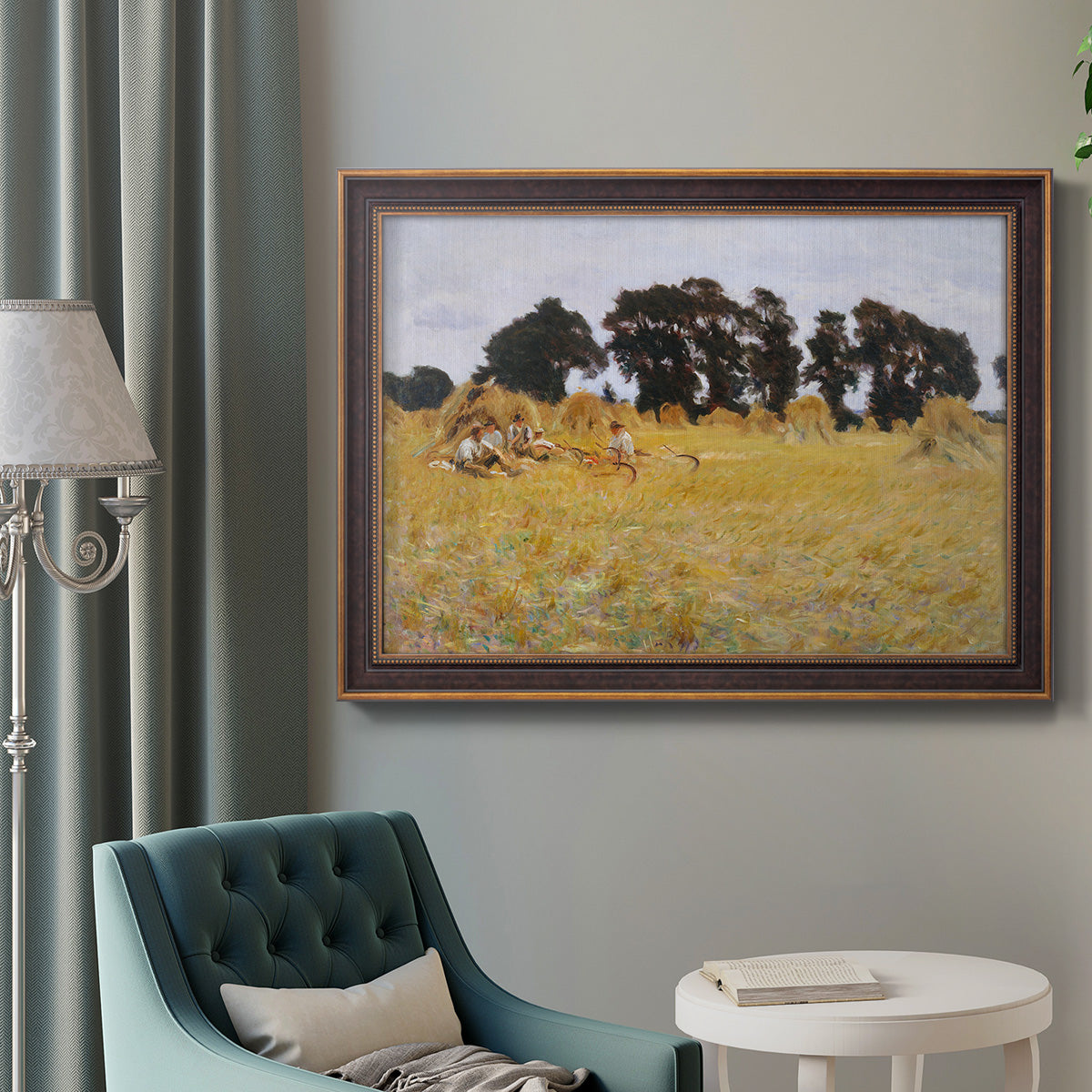 Impressionist rural harvest scene by John Singer Sargent in an ornate bronzed mahogany wood frame displayed in a bright interior setting.