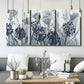 Three-panel canvas wall art featuring indigo floral abstraction, displayed in a modern living room above seating.
