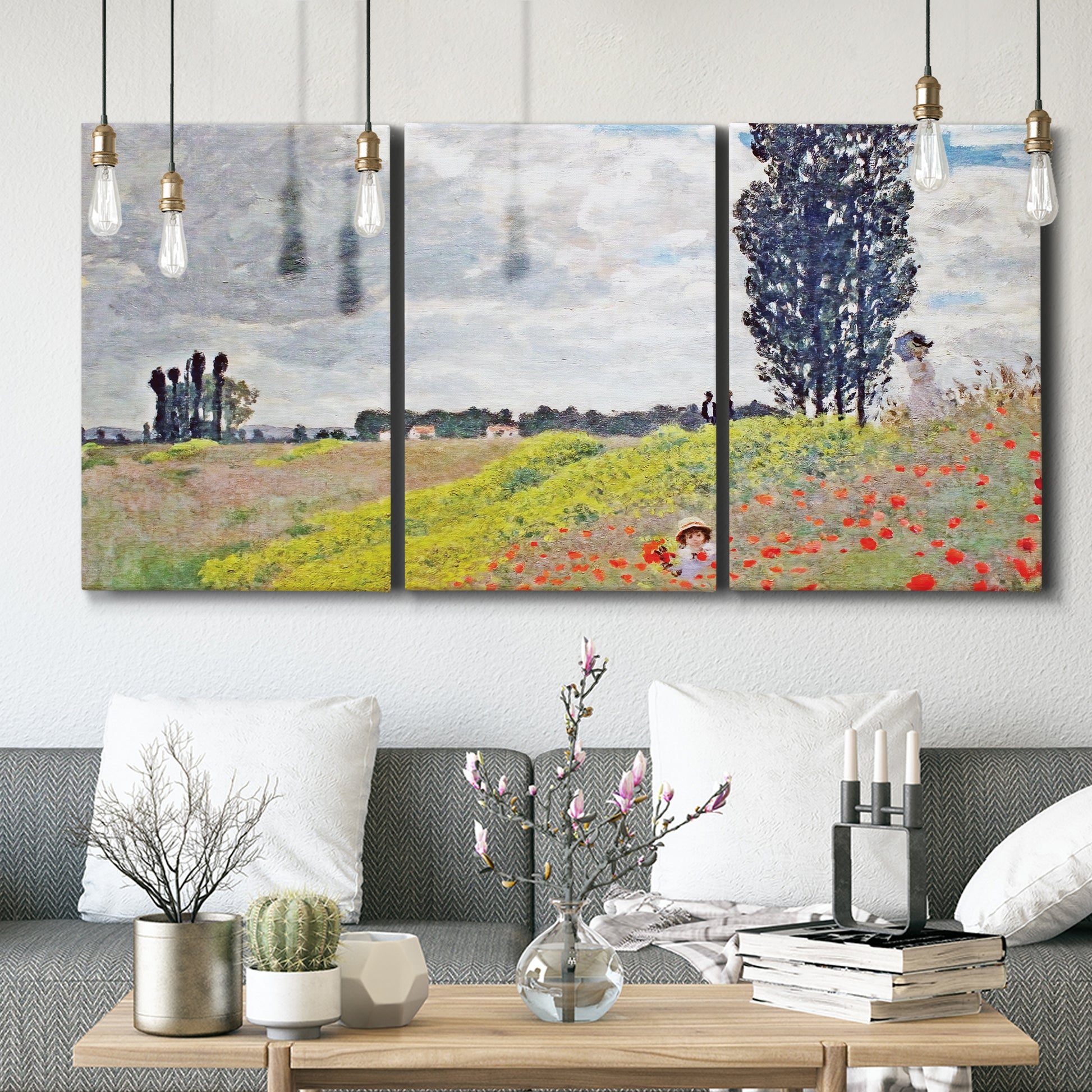 Three-panel canvas wall art featuring open poppy field in countryside, displayed in a modern living room above seating.