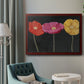 Contemporary poppy flower artwork in an ornate cherry burl wood frame displayed in a neutral interior setting.