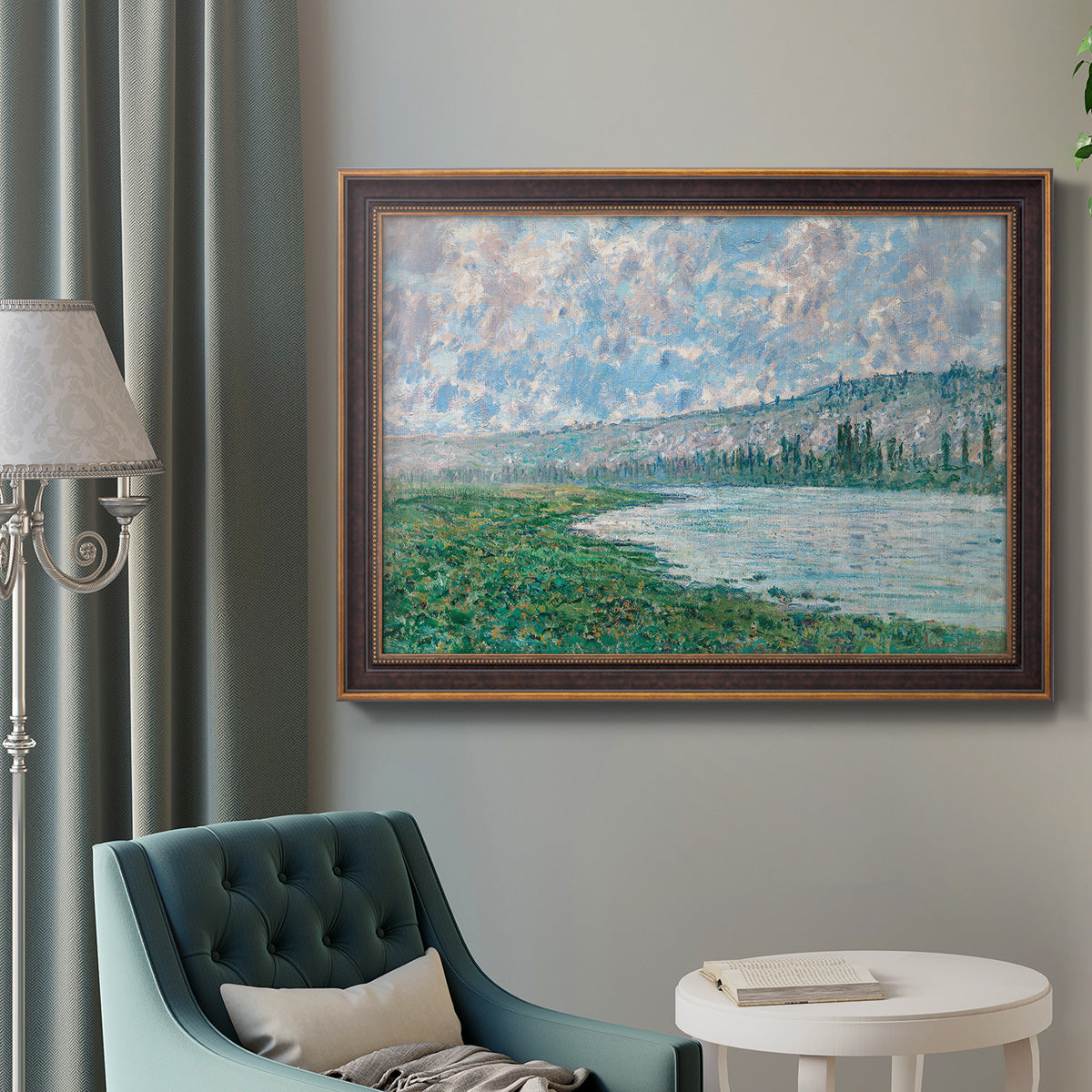 Impressionist river landscape at Vétheuil by Claude Monet in an ornate bronzed mahogany wood frame displayed in a bright interior setting.