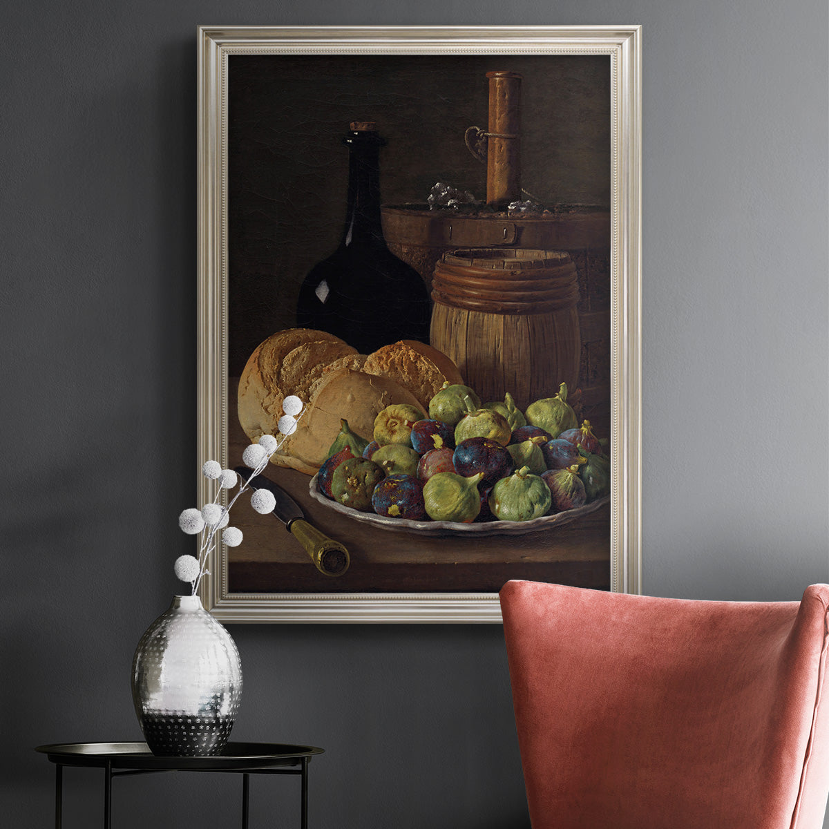 Realist still life with figs and bread by Luis Meléndez in an ornate champagne frame displayed in a dark-toned interior setting.