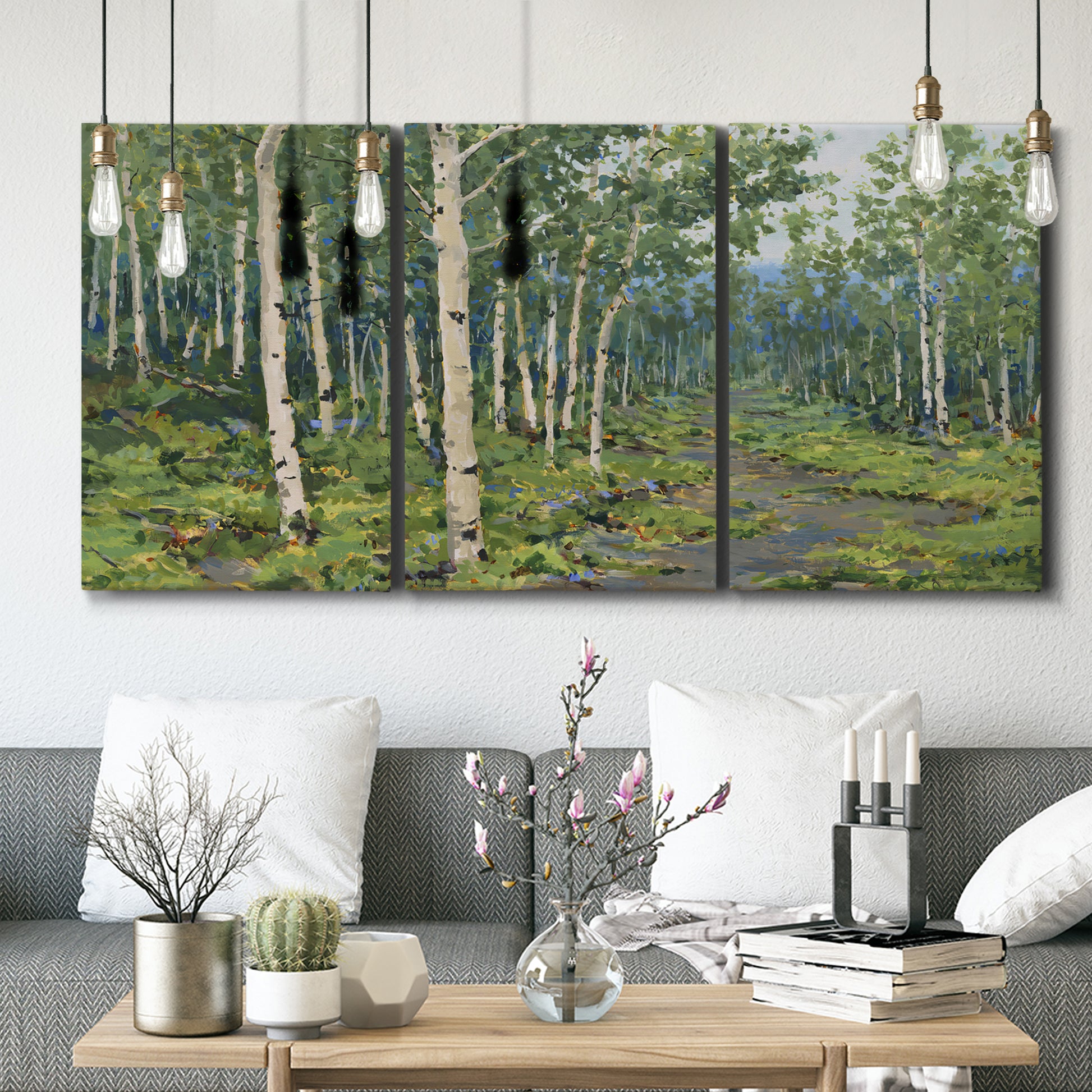Three-panel canvas wall art featuring woodland forest scene with tall trees, displayed in a modern living room above seating.