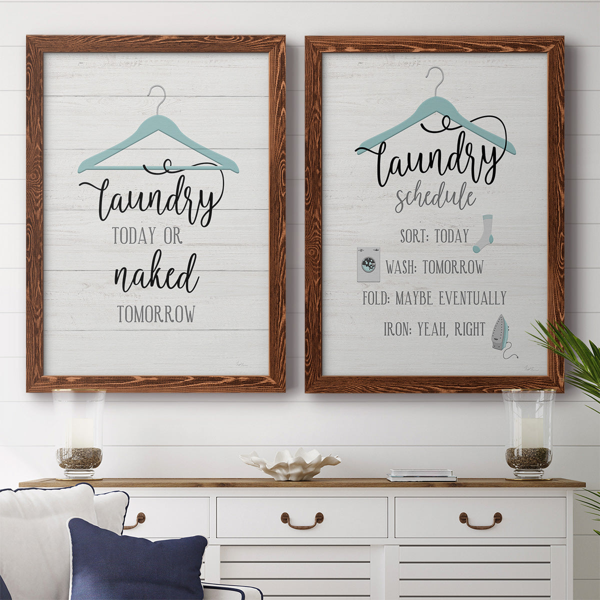 Set of two maple barnwood framed canvas prints depicting a coordinated art pair of humorous laundry-room sayings and clothing icons rendered as rustic typographic wall art above a dining room sideboard.