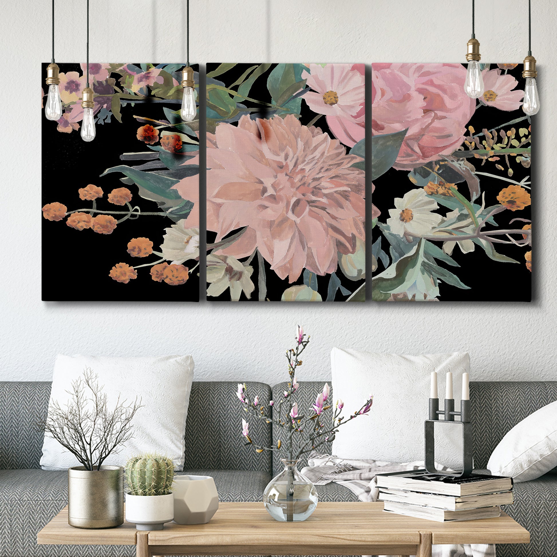 Three-panel canvas wall art featuring dark floral night blossoms, displayed in a modern living room above seating.