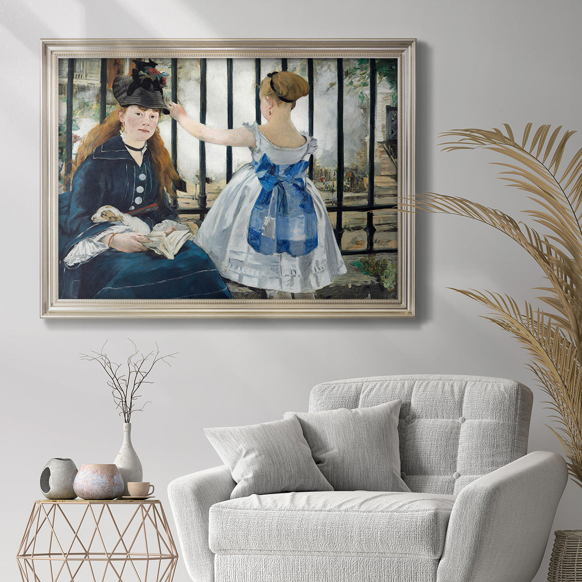 Impressionist urban scene near a railway by Édouard Manet in an ornate champagne frame displayed in a bright interior setting.