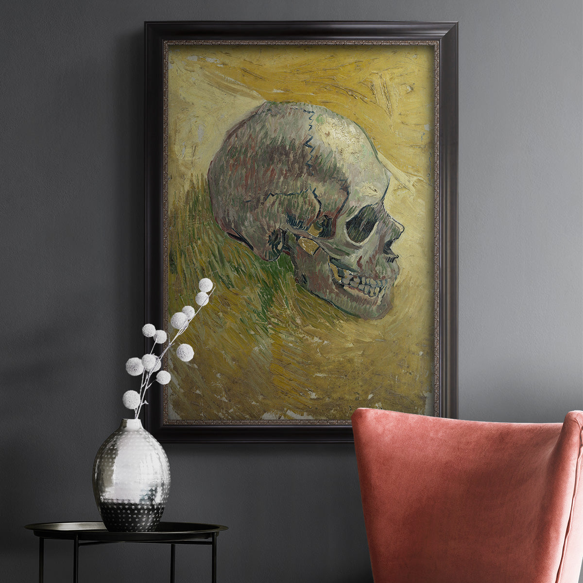 Profile skull study artwork by Vincent van Gogh in an ornate black frame with gilded inner detail displayed in a dark-toned interior setting.