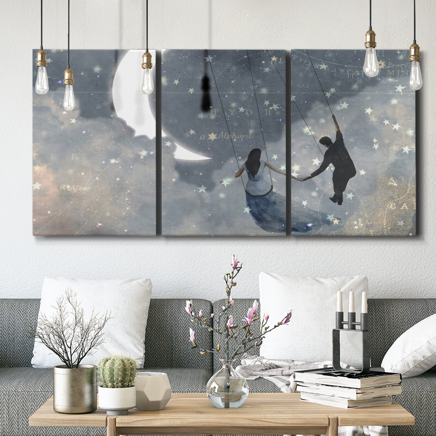 Three-panel canvas wall art featuring surreal celestial romantic scene, displayed in a modern living room above seating.