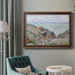 Impressionist coastal watch cabin scene by Claude Monet in an ornate bronzed mahogany wood frame displayed in a bright interior setting.