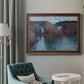 Impressionist rocky seascape by Claude Monet in an ornate bronzed mahogany wood frame displayed in a bright interior setting.