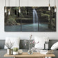 Three-panel canvas wall art featuring waterfall cascading through forest, displayed in a modern living room above seating.