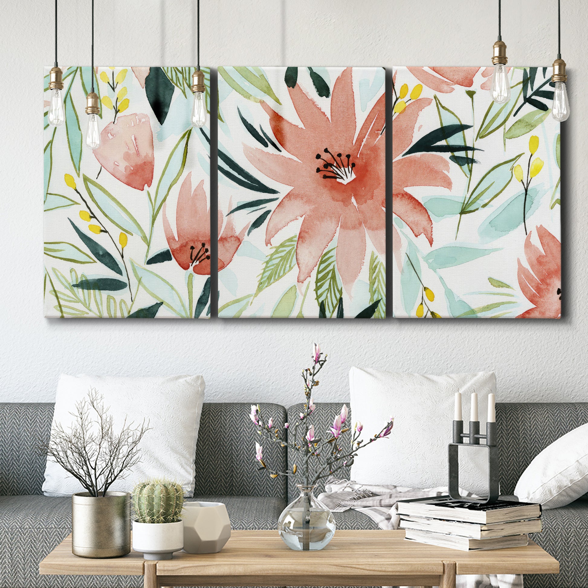 Three-panel canvas wall art featuring tropical botanical collage, displayed in a modern living room above seating.