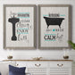 Set of two gray barnwood framed canvas prints depicting a coordinated art pair of playful bathtub silhouettes and bath-themed typography rendered as graphic bathroom word art above a dining room sideboard.