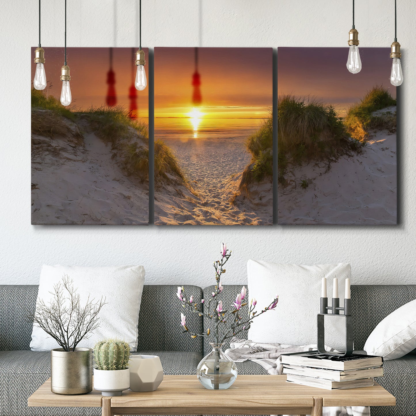 Three-panel canvas wall art featuring sunlit tropical path through greenery, displayed in a modern living room above seating.
