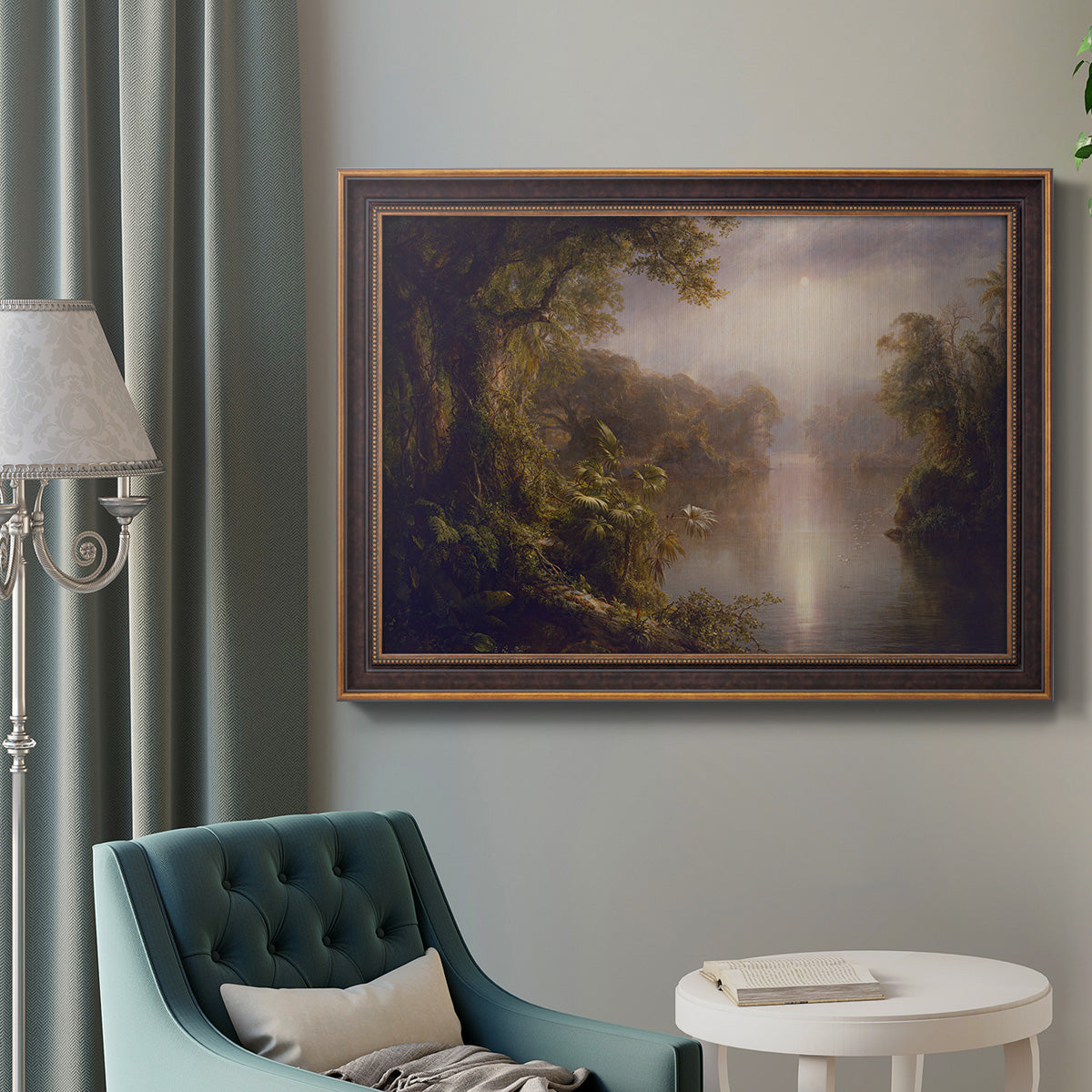 Luminous romantic landscape painting by Frederic Edwin Church in an ornate bronzed mahogany wood frame displayed in a bright interior setting.