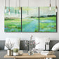 Three-panel canvas wall art featuring gentle stream winding through trees, displayed in a modern living room above seating.