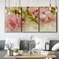Three-panel canvas wall art featuring soft floral blossom composition, displayed in a modern living room above seating.