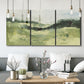 Three-panel canvas wall art featuring rolling hillside countryside landscape, displayed in a modern living room above seating.