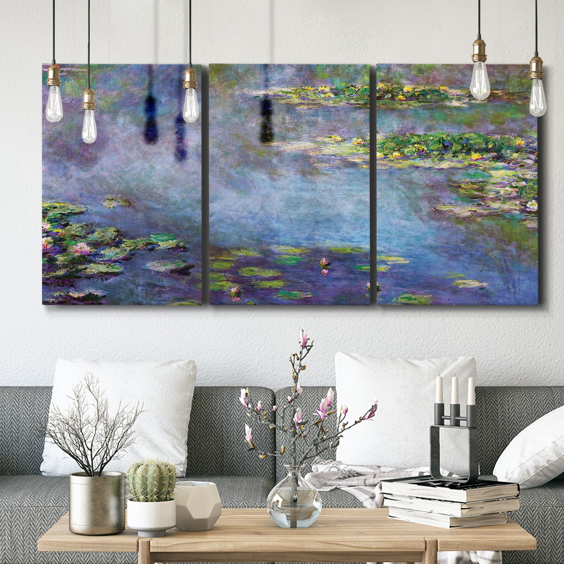 Three-panel canvas wall art featuring water lilies emerging through mist, displayed in a modern living room above seating.