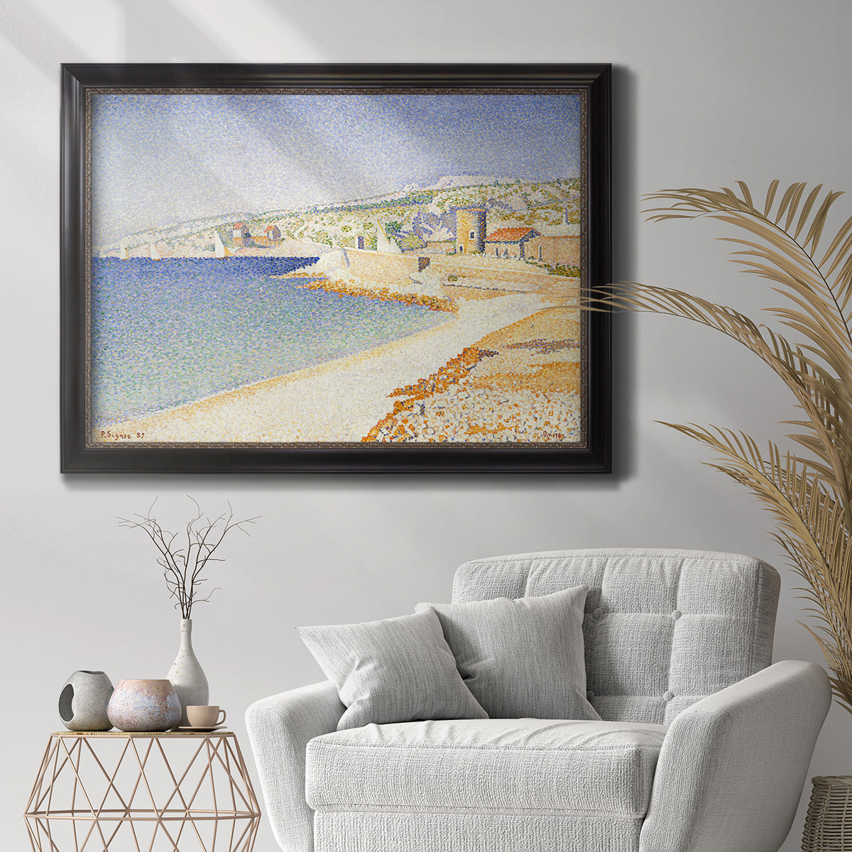 Impressionist Mediterranean jetty seascape by Paul Signac in an ornate black frame with gilded inner detail displayed in a bright interior setting.