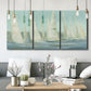 Three-panel canvas wall art featuring sailboats silhouetted at sunrise, displayed in a modern living room above seating.