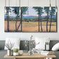 Three-panel canvas wall art featuring quiet morning landscape with trees, displayed in a modern living room above seating.