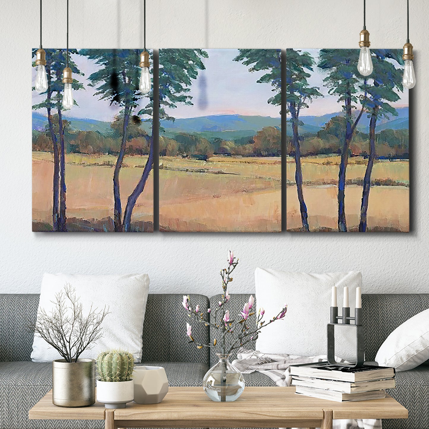 Three-panel canvas wall art featuring quiet morning landscape with trees, displayed in a modern living room above seating.