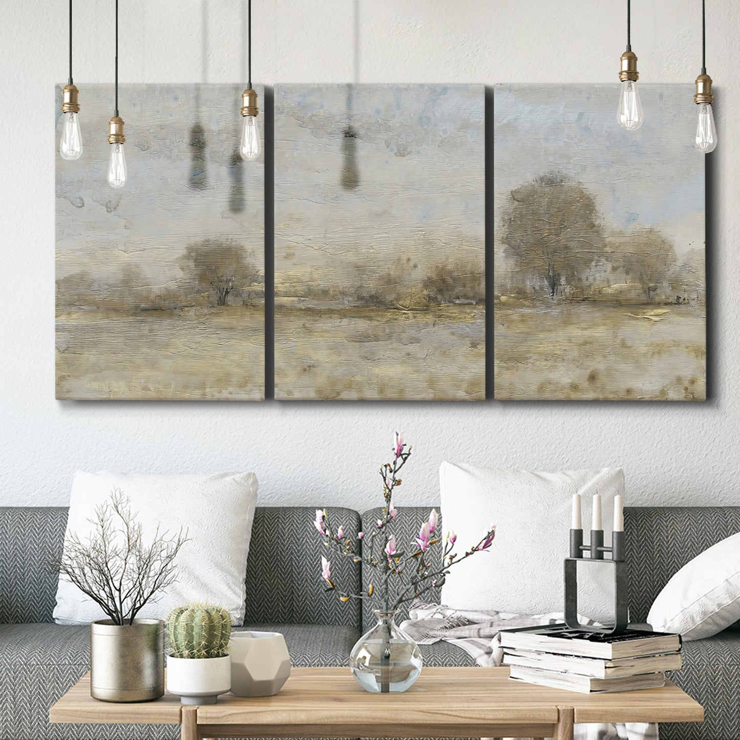 Three-panel canvas wall art featuring late season rural harvest fields, displayed in a modern living room above seating.