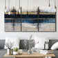 Three-panel canvas wall art featuring abstract blue urban composition, displayed in a modern living room above seating.