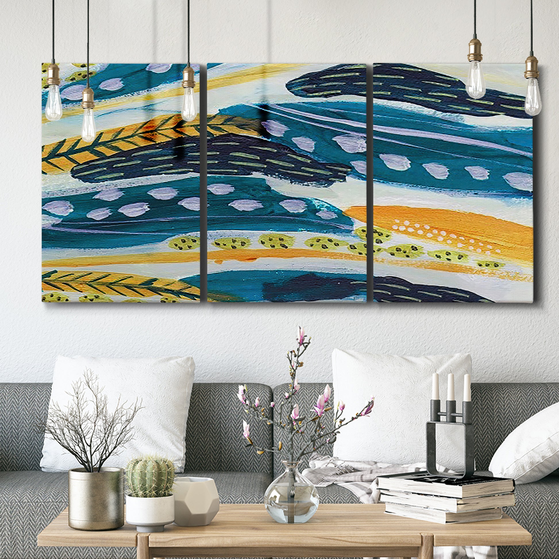Three-panel canvas wall art featuring feather inspired abstract linear motion, displayed in a modern living room above seating.