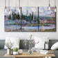 Three-panel canvas wall art featuring summer village view along river, displayed in a modern living room above seating.