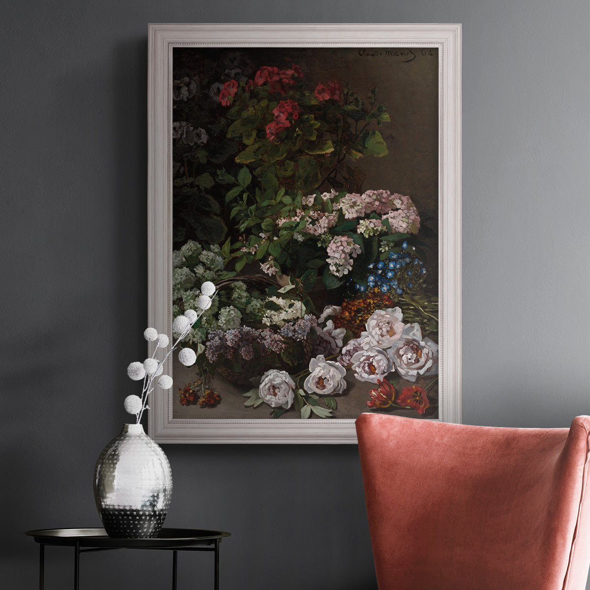 Early impressionist floral painting by Claude Monet in an ornate weathered white frame displayed in a dark-toned interior setting.