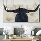 Three-panel canvas wall art featuring rustic animal portrait illustration, displayed in a modern living room above seating.