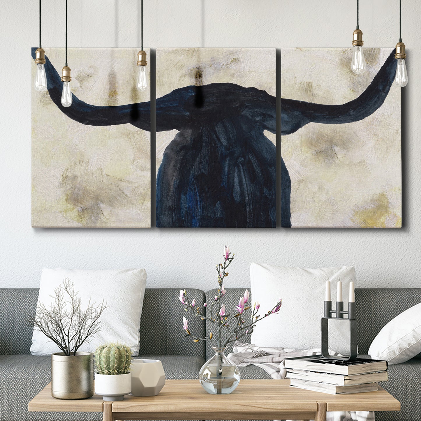 Three-panel canvas wall art featuring rustic animal portrait illustration, displayed in a modern living room above seating.