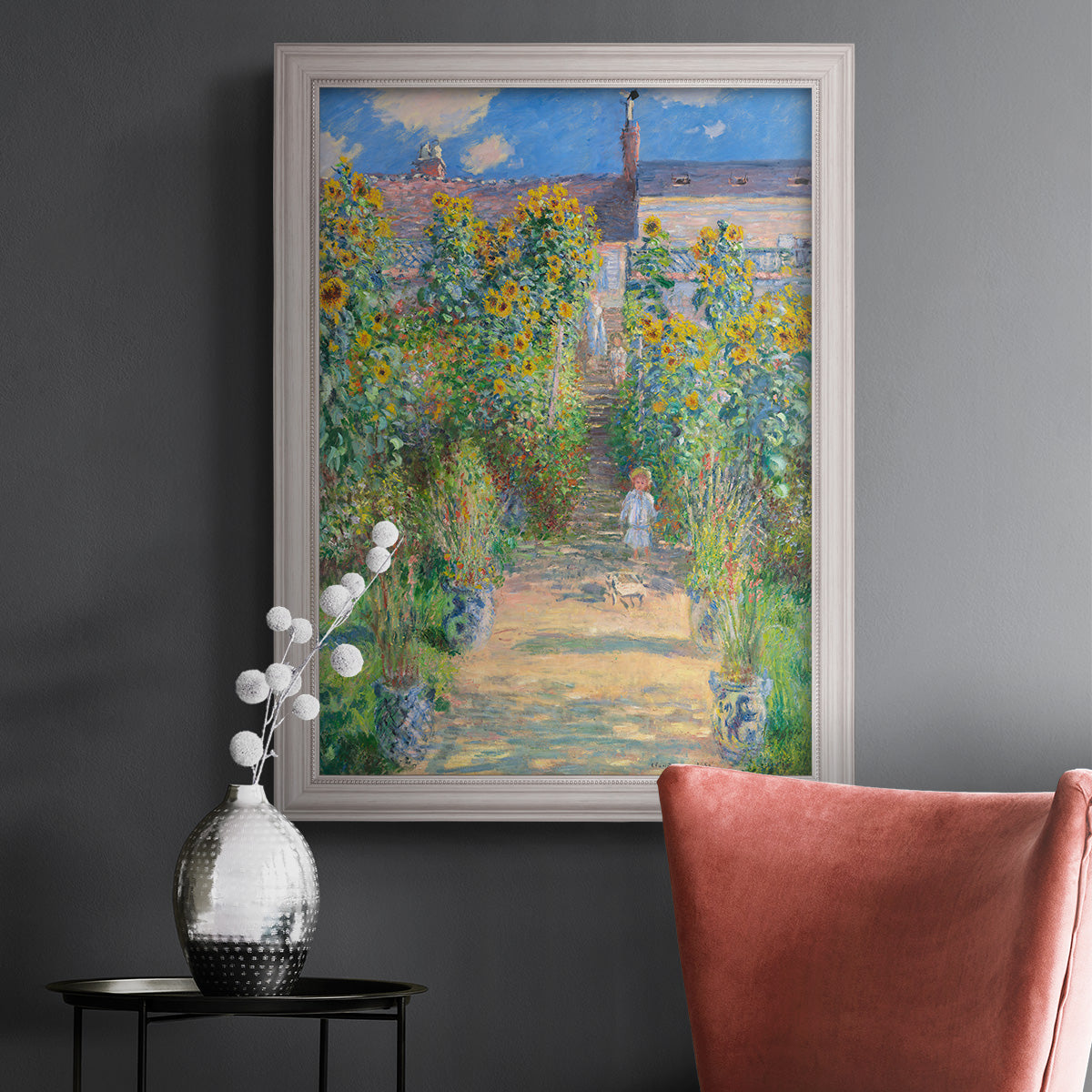 Impressionist garden landscape painting by Claude Monet in an ornate weathered white frame displayed in a dark-toned interior setting.
