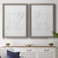 Set of two gray barnwood framed canvas prints depicting a coordinated art pair of simple contour drawings of standing cows rendered as minimalist livestock sketches above a dining room sideboard.