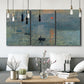 Three-panel canvas wall art featuring misty harbor sunrise with boats, displayed in a modern living room above seating.