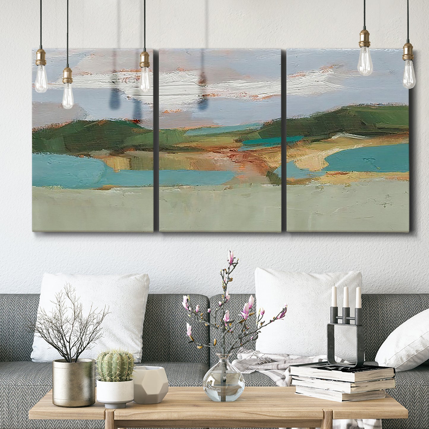 Three-panel canvas wall art featuring wide open landscape under midday light, displayed in a modern living room above seating.