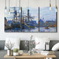 Three-panel canvas wall art featuring industrial dock along harbor, displayed in a modern living room above seating.