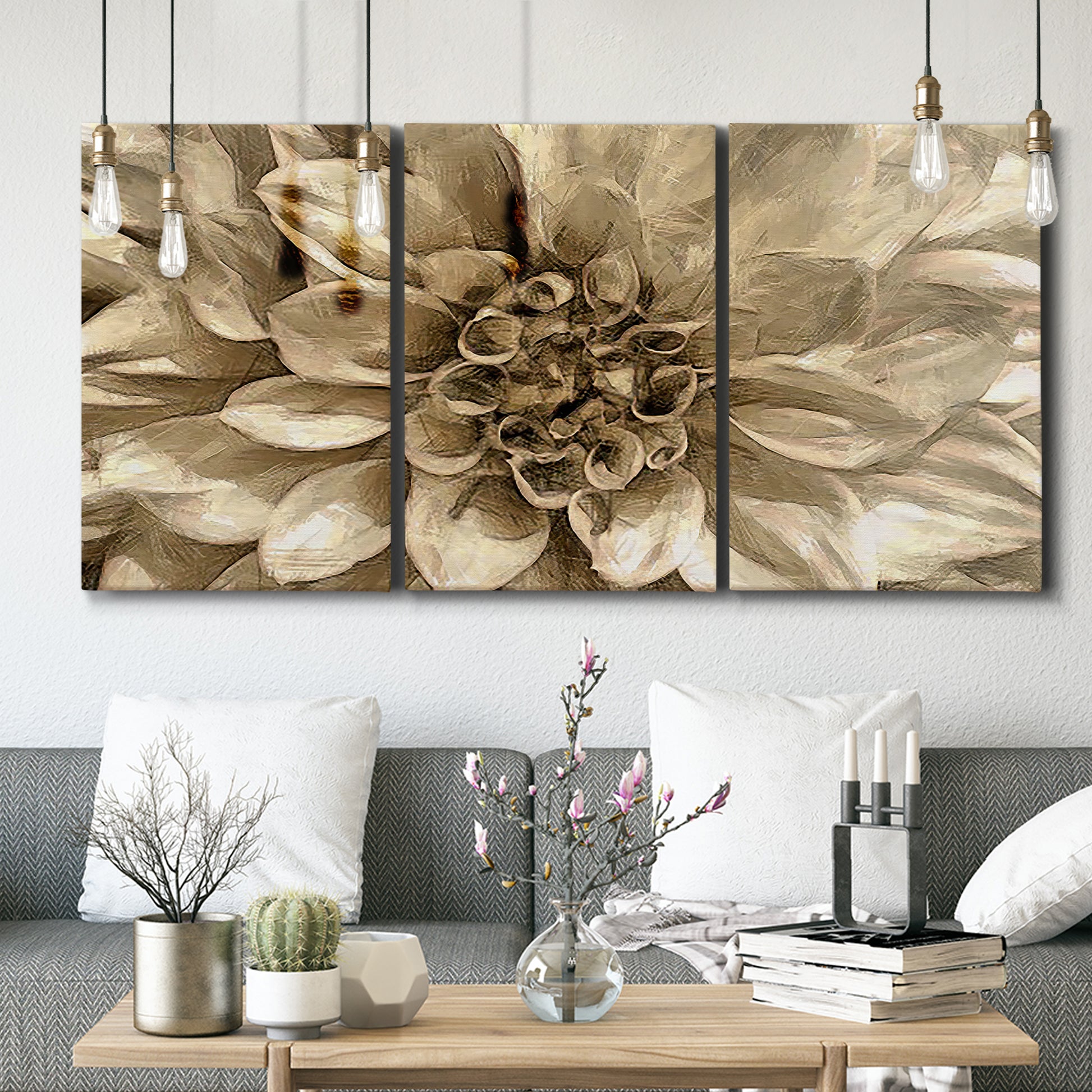 Three-panel canvas wall art featuring monochrome floral linework composition, displayed in a modern living room above seating.