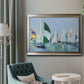 Coastal harbor watercolor painting in an ornate mottled silver frame displayed in a neutral interior setting.