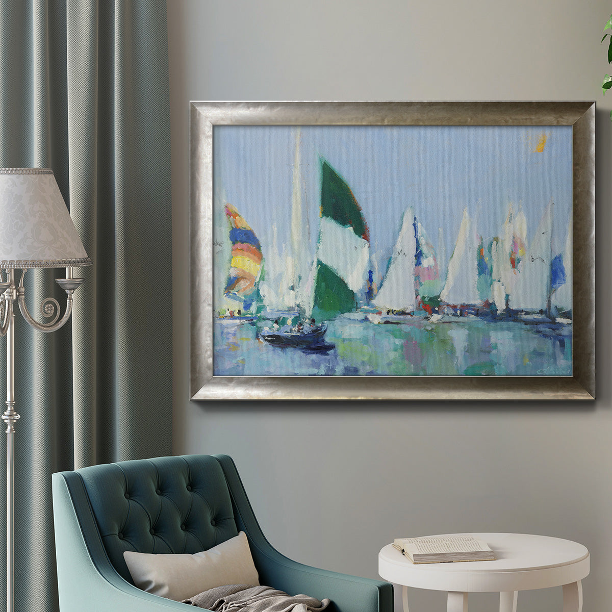 Coastal harbor watercolor painting in an ornate mottled silver frame displayed in a neutral interior setting.